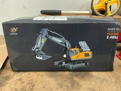 UNUSED TOY EXCAVATOR