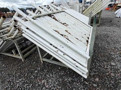 GALVANISED METAL STILLAGE & APPROX. 5No. SOLID METAL TEMPORARY FENCING PANELS