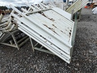 GALVANISED METAL STILLAGE & APPROX. 5No. SOLID METAL TEMPORARY FENCING PANELS