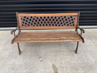 TWO SEATER OUTDOOR WOODEN BENCH WITH CAST IRON SIDES